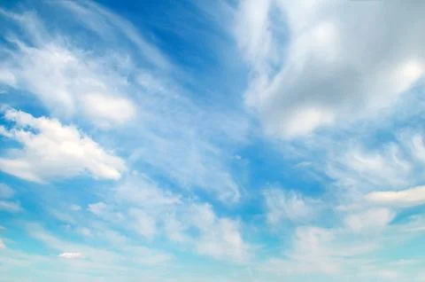 Light cumulus clouds in the blue sky. Stock Photos
