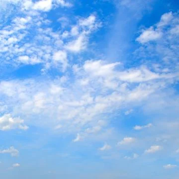 Light cumulus clouds in the blue sky. 스톡 사진