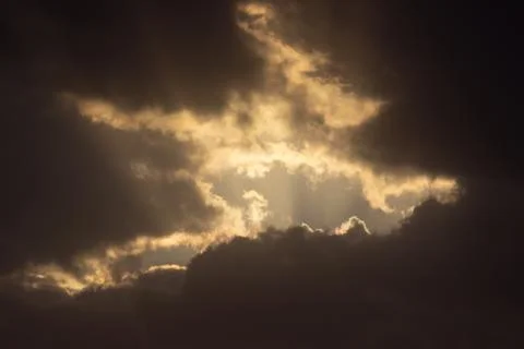 Light in the Dark and Dramatic Storm Clouds Stock Photos
