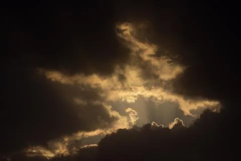 Light in the Dark and Dramatic Storm Clouds Stock Photos