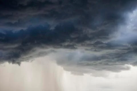 Light in the Dark and Dramatic Storm Clouds background Fotos de archivo