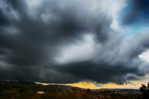 Light in the dark and dramatic storm clouds background. Storm clouds. Superce Stock Photos