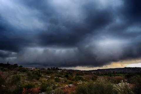 Light in the dark and dramatic storm clouds background. Storm clouds. Superce Stock Photos