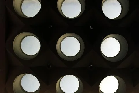 Light dark pattern of round windows of industrial character Foto stock