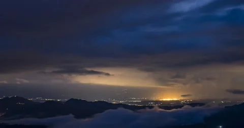 Light to dark time lapse over hills and Ljubljana basin in Slovenia Stock Footage 138875513