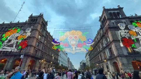 Light decoration for Day of the Dead at sunset. People in Zocalo, CDMX Stock Footage 292684313