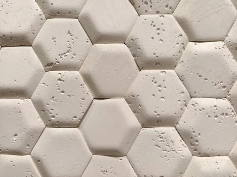 Light decorative panels with hexagon inspired texture shown in a hardware s.. Foto stock