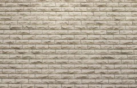 Light decorative stone brick wall. Modern architectural background Stock Photos