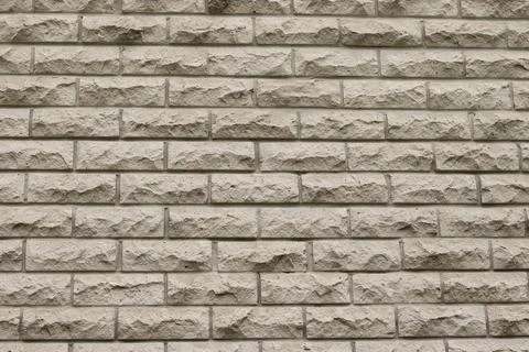 Light decorative stone brick wall. Modern architectural background Stock Photos
