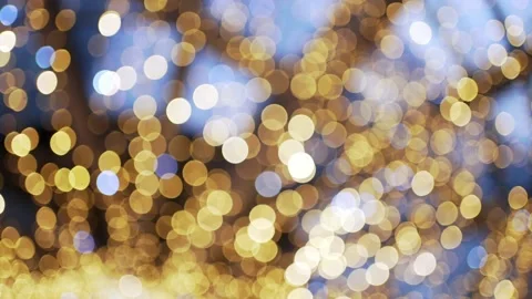 Light defocused. Glowing ilumination. Decorative golden round lights 動画素材 154307492