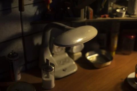 Light on desk. Items on computer desk. Stock Photos