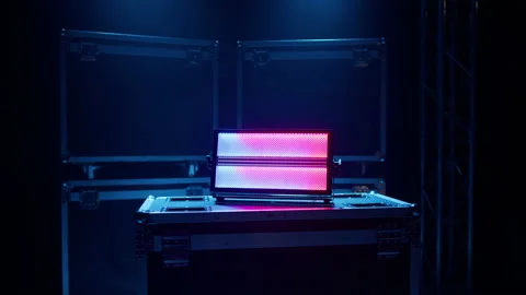 A light device that changes the light on the background of boxes Stock Footage 194439084