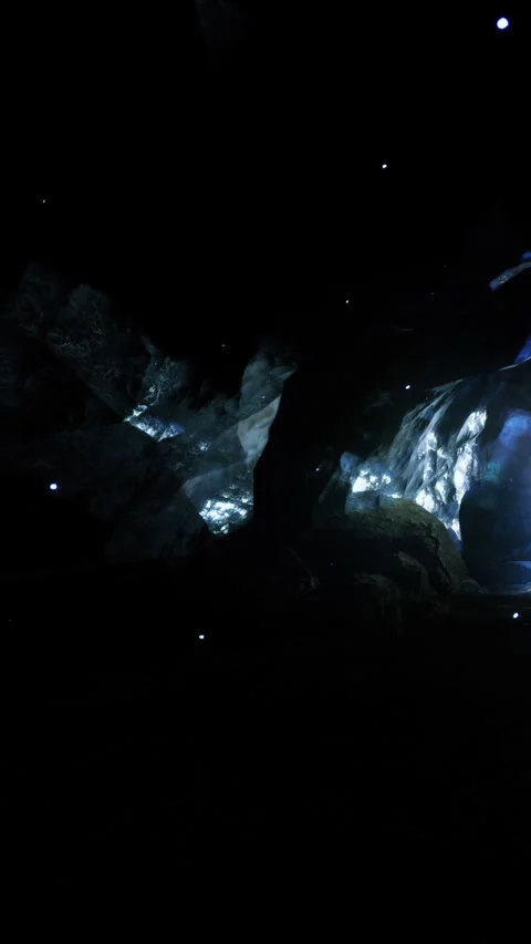 Light display in a cave shows patterns during a nighttime event Stock Footage 330339243