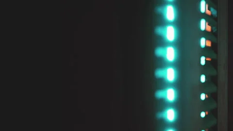 Light display at night on an electronic device in a dark space Stock Footage 345007477