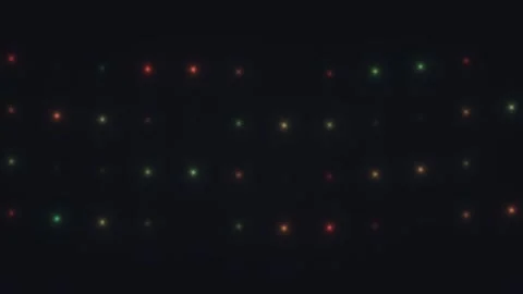 Light dots move in a rhythmic pattern on a dark background Stock Footage 338189101