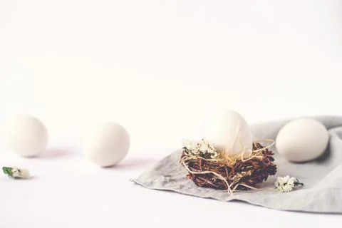 Light Easter background with Easter eggs. Stock Photos