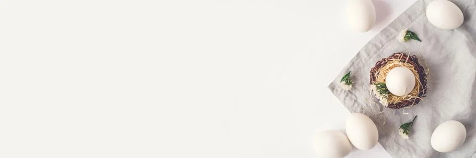 Light Easter background with Easter eggs. Stock Photos