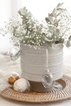 Light Easter composition with Easter eggs and gypsophila flowers. Stock Photos