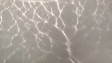 Light effect on a white background, the reflection of light Stock Footage 132874444