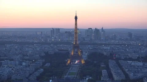 Light Eiffel tower in the Paris city heart, colored evening sky Stock Footage 69181399