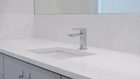Light elegant modern bathroom interior with washing sink and grey toilet Stock Footage 245770584