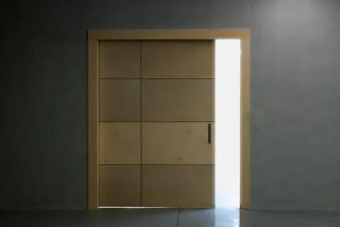 A light emanating from the crevice of a slightly open wooden door. Stock Photos