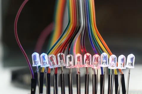 Light emitting diode or LED with glowing lights arranged in a breadboard Foto stock
