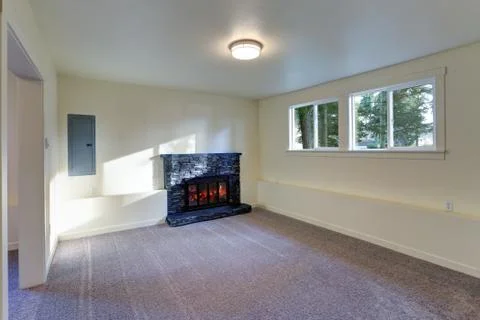 Light empty living room interior with milky walls framing a wall mounted fire Stock Photos