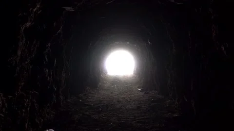 Light at the end of a long cave. | Stock Video Pond5