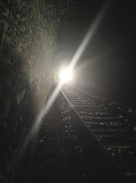 Light at the end of the train tunnel Stock Photos