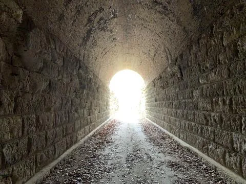 Light at the end of the train tunnel Stock Photos