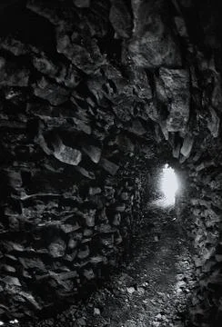 A light in the end of a tunnel. Stock Photos