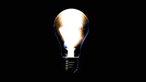 Light energy transmitted by a light bulb Stock Footage 99820577
