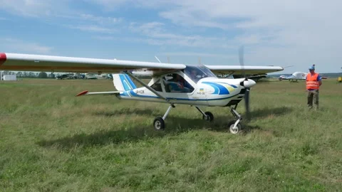 A light-engine aircraft KhAZ-30 is taxiing to the runway Stock Footage 170909336