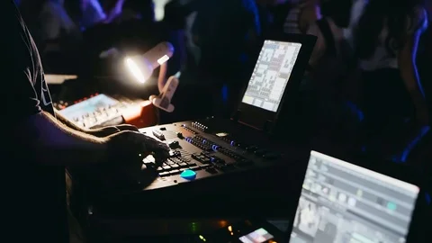 Light engineer working at mixing panel. Stock Footage 96743409