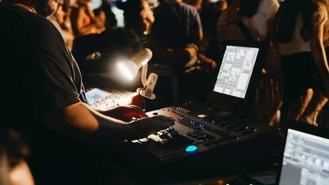 Light engineer working at mixing panel, crane shot. Stock Footage 96743495