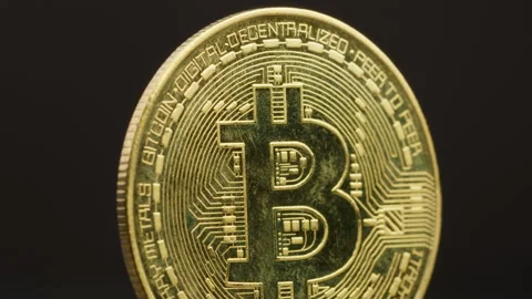 Light Enhancing The Details Of A Golden Bitcoin Stock Footage 270312992