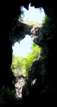 Light entering through an opening in a cave Stock Photos