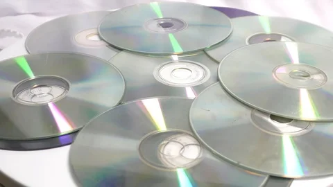 The light falling on cds and dvds and moving Stock Footage 111887887