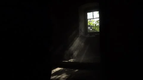Light falling through the window of an old underground ancient building Video stock 329393063
