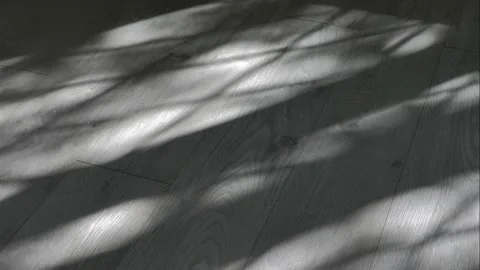 Light falling from the window moves across the floor. Stock-Footage 144588804