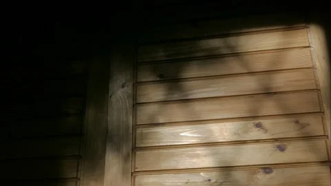 The light falling from the window moves along the door of the room cabinet. Video stock 141025152