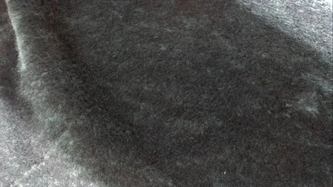 Light falling from the window moves over the fur product. Video stock 150055906