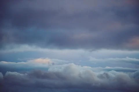 Light falls on the clouds in the evening sky, Stock Photos