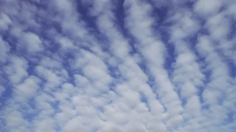 Light feathery clouds in a blue spring sky. Beautiful nature pattern above your Stock-Footage 309415553