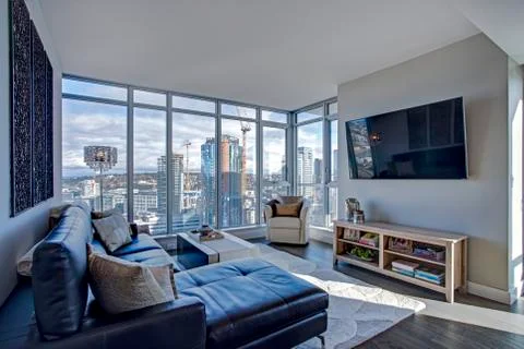 Light filled floor plan boasts a modern family room design with panoramic vie Stock Photos