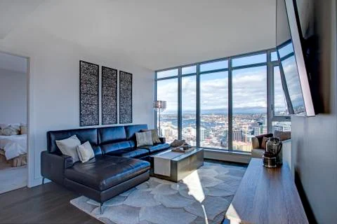 Light filled floor plan boasts a modern family room design with panoramic vie Stock Photos