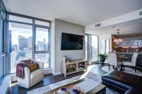 Light filled floor plan boasts a modern family room design with panoramic vie Stock Photos