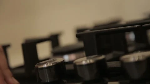 Light a fire on a gas cooker Stock Footage 48813355