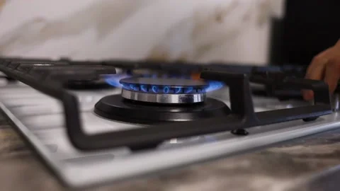 Light a fire on the gas stove and put a frying pan in. Stock Footage 231814341